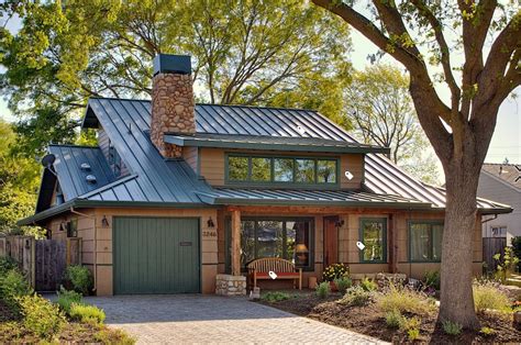 beige house with green metal roof|house with green roof.